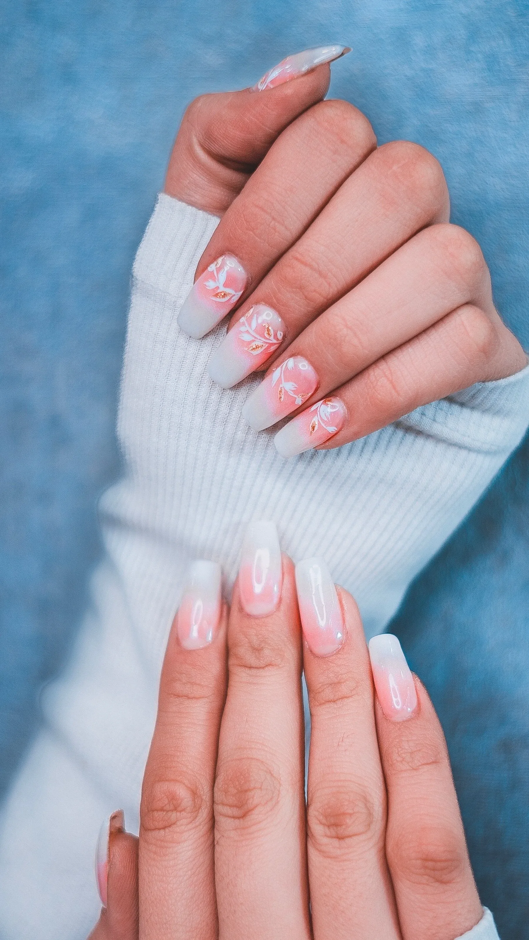 Milky base nails featuring delicate hand-painted botanical floral art